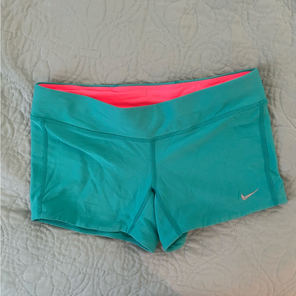 Nike dri-fit tight running shorts, size medium, teal.